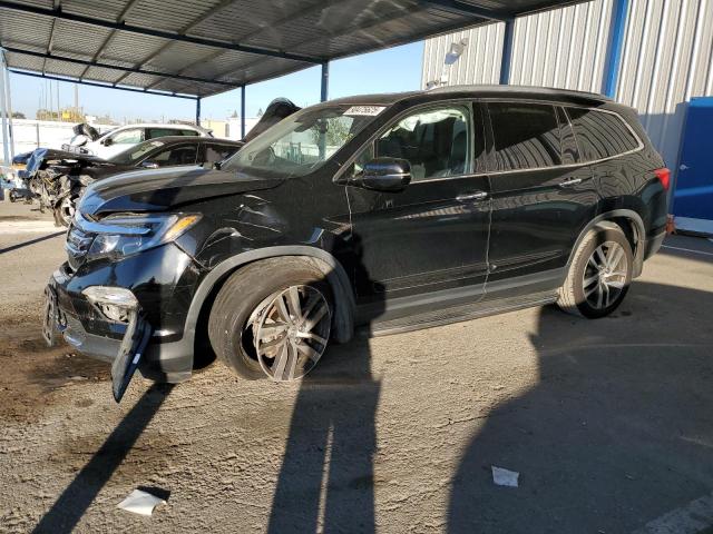 HONDA PILOT TOUR 2017 with VIN 5FNYF6H94HB086627 - Photo from auction