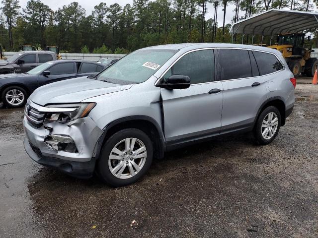 HONDA PILOT LX 2018 with VIN 5FNYF5H12JB009670 - Photo from auction