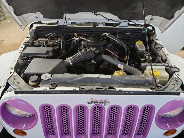 Photo 11 from auction – 2011 JEEP WRANGLER U with VIN 1J4BA5H19BL557873