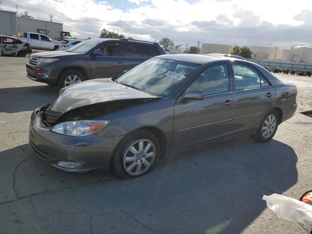 TOYOTA CAMRY LE 2004 with VIN 4T1BF30K24U574300 - Photo from auction