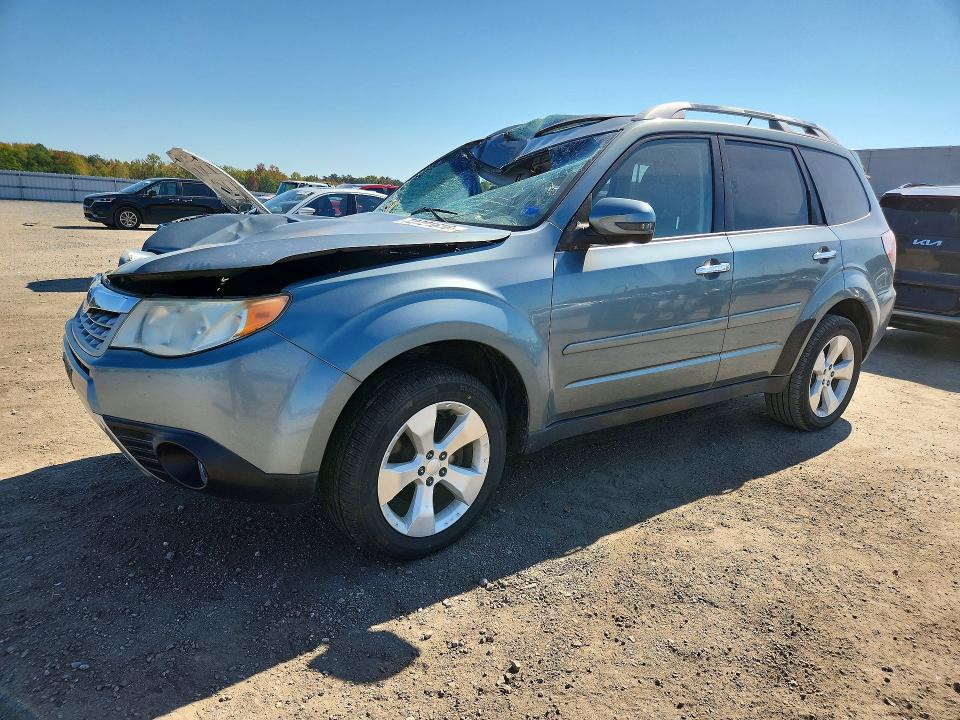SUBARU FORESTER 2011 with VIN JF2SHGGC0BH715621 - Photo from auction