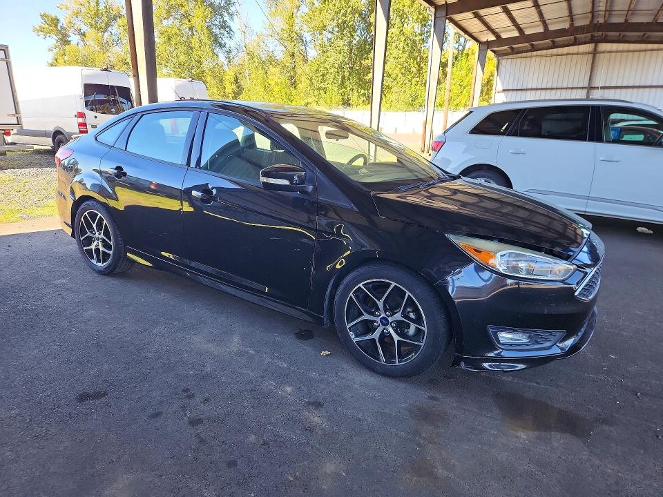 Снимка 4 от търг – 2015 FORD FOCUS с VIN 1FADP3F22FL364117