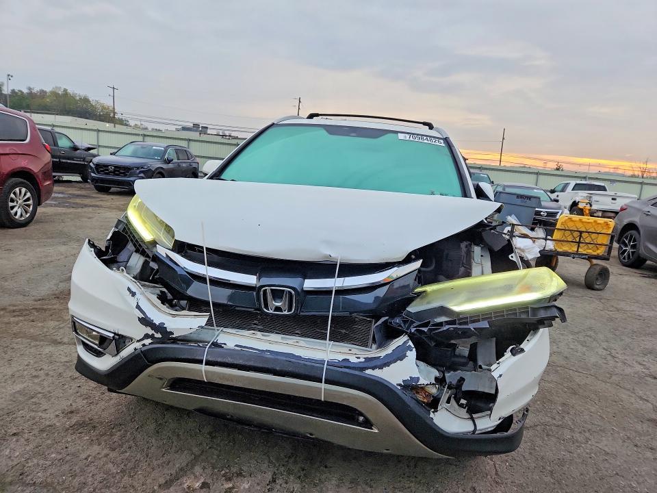Photo 5 from auction – 2016 HONDA CR-V with VIN 5J6RM4H72GL046453