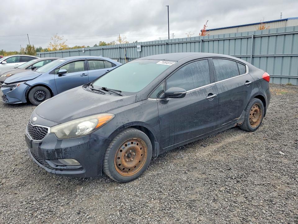 KIA FORTE 2014 con VIN KNAFX4A84E5148211 - Foto de la subasta
