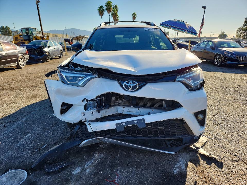 Photo 5 from auction – 2016 TOYOTA RAV4 with VIN JTMNFREV4GJ063345