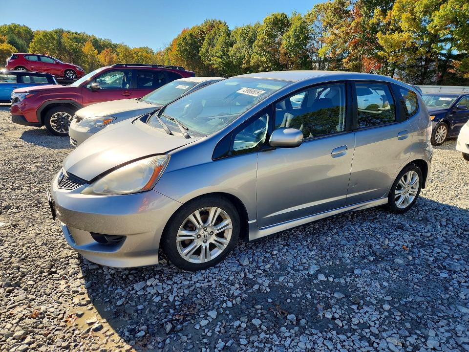 HONDA FIT 2009 с VIN JHMGE884X9S029298 - Снимка от търг