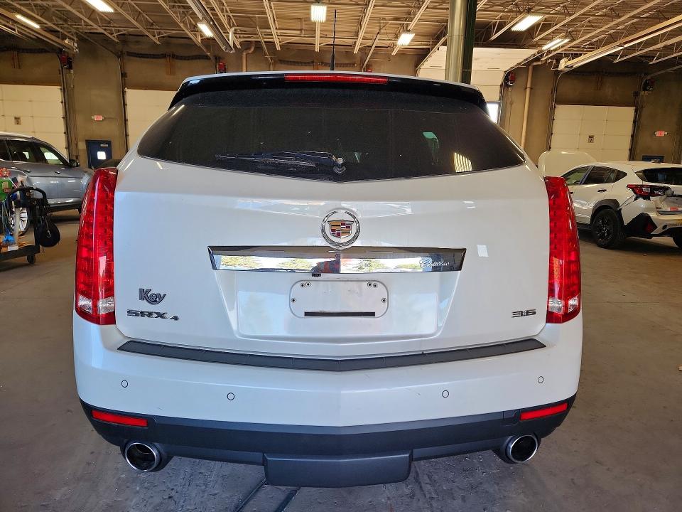 Снимка 6 от търг – 2014 CADILLAC SRX с VIN 3GYFNGE36ES644877