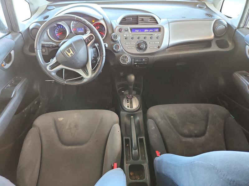 Снимка 8 от търг – 2009 HONDA FIT с VIN JHMGE88409S013109