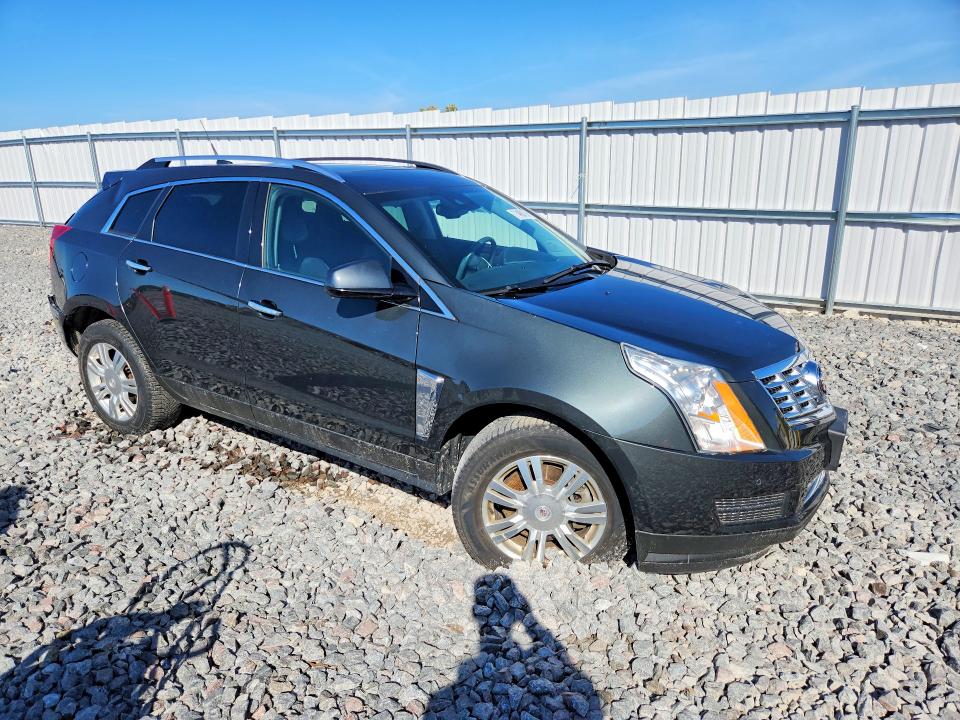 Foto 4 de la subasta – 2014 CADILLAC SRX con VIN 3GYFNBE31ES686621