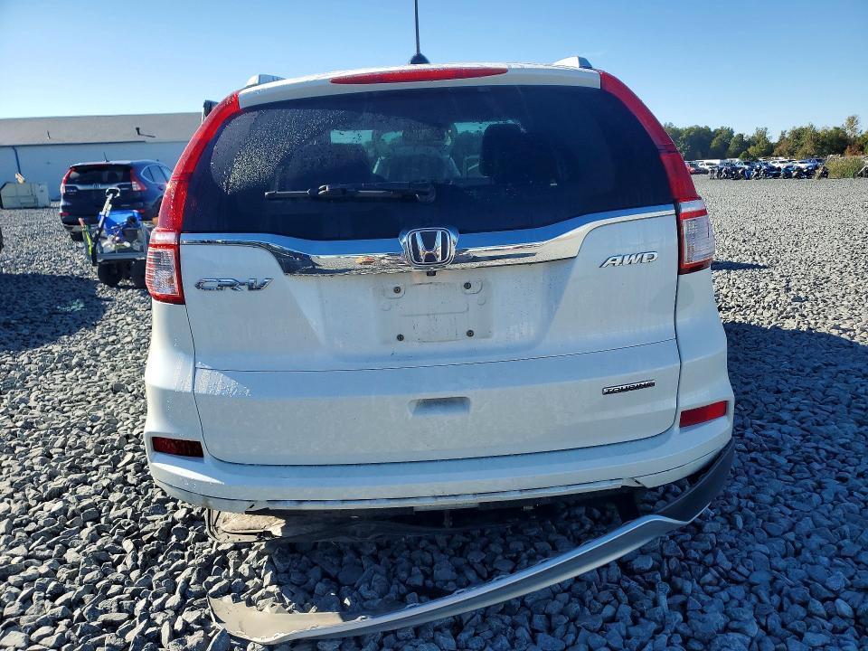 Photo 6 from auction – 2016 HONDA CR-V with VIN 5J6RM4H9XGL074857