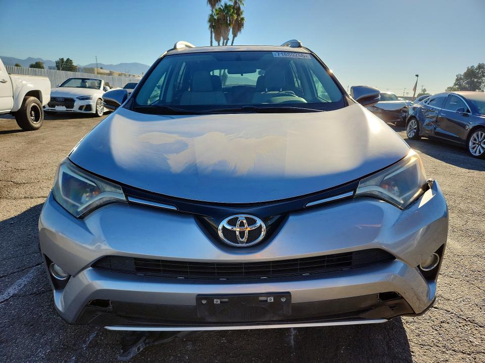 Photo 5 from auction – 2016 TOYOTA RAV4 with VIN 2T3WFREV3GW252798