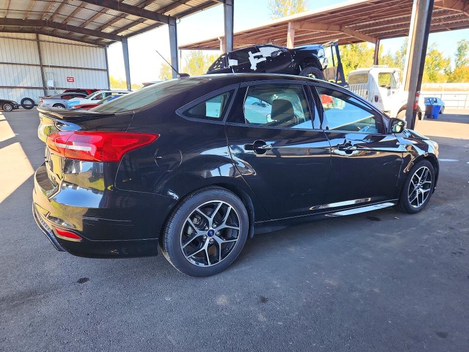 Снимка 3 от търг – 2015 FORD FOCUS с VIN 1FADP3F22FL364117