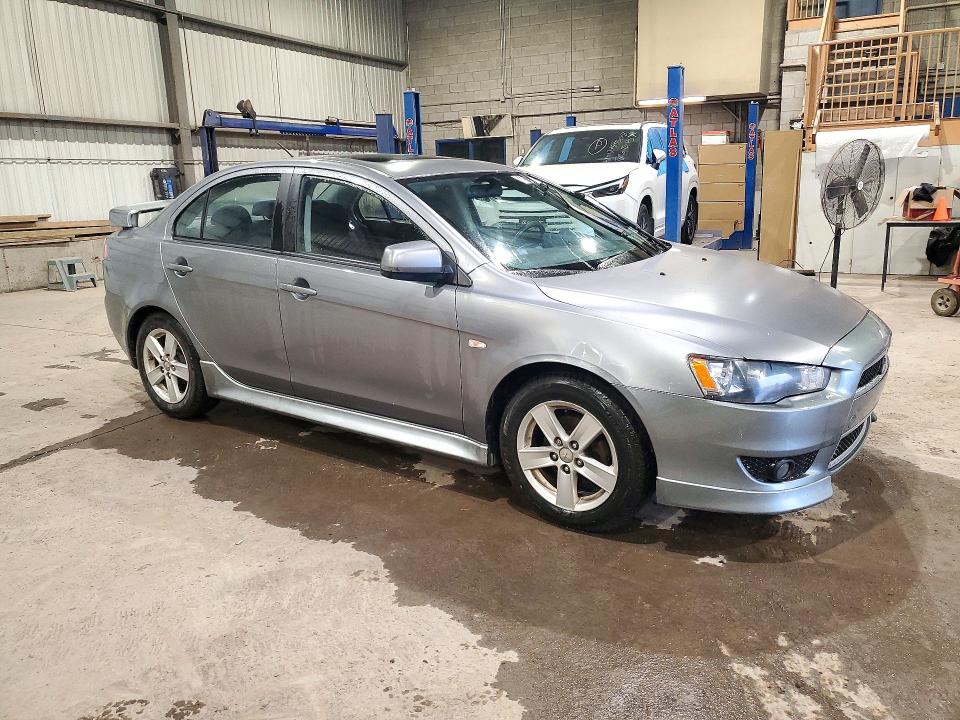 Снимка 4 от търг – 2014 MITSUBISHI LANCER с VIN JA32U2FU2EU607308