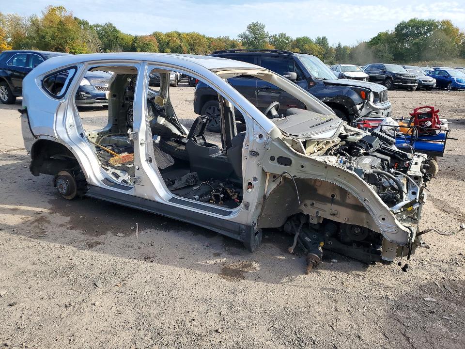 Photo 4 from auction – 2015 HONDA CR-V with VIN 2HKRM4H56FH669047