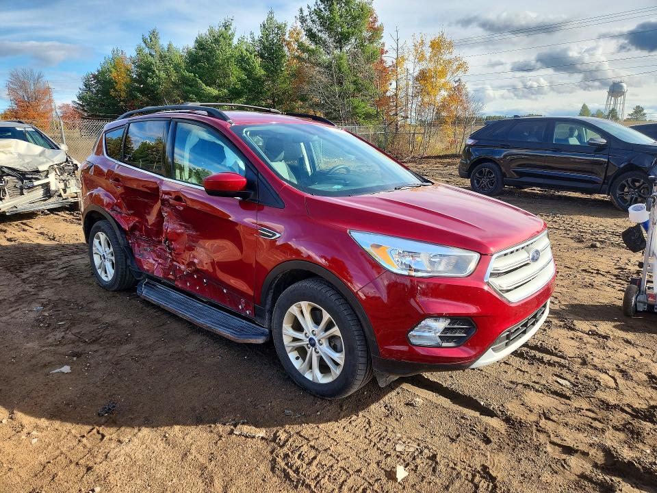 Photo 4 from auction – 2018 FORD ESCAPE with VIN 1FMCU9GD3JUA36057