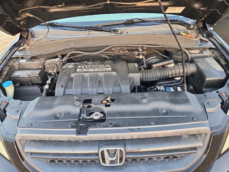 Снимка 12 от търг – 2005 HONDA PILOT с VIN 5FNYF18425B061468