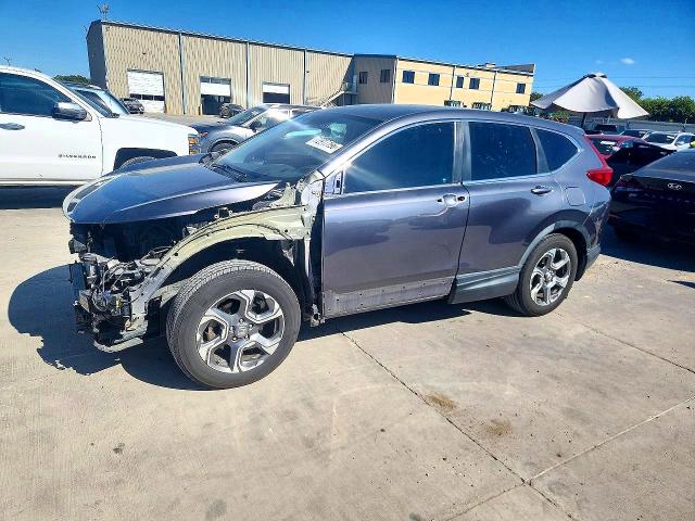 Photo 1 from auction – 2018 HONDA CR-V with VIN 5J6RW1H57JA011580