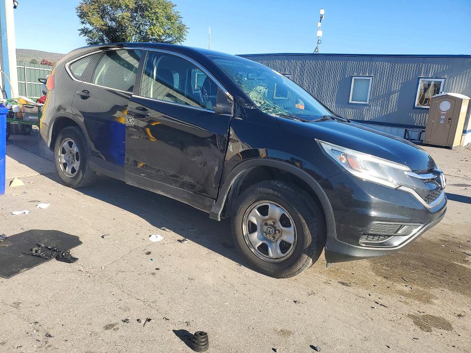 Photo 4 from auction – 2015 HONDA CR-V with VIN 2HKRM4H31FH698194