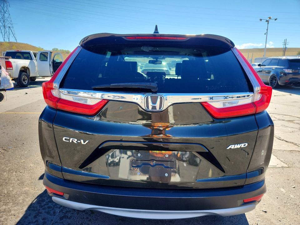 Photo 6 from auction – 2018 HONDA CR-V with VIN 7FARW2H82JE102564