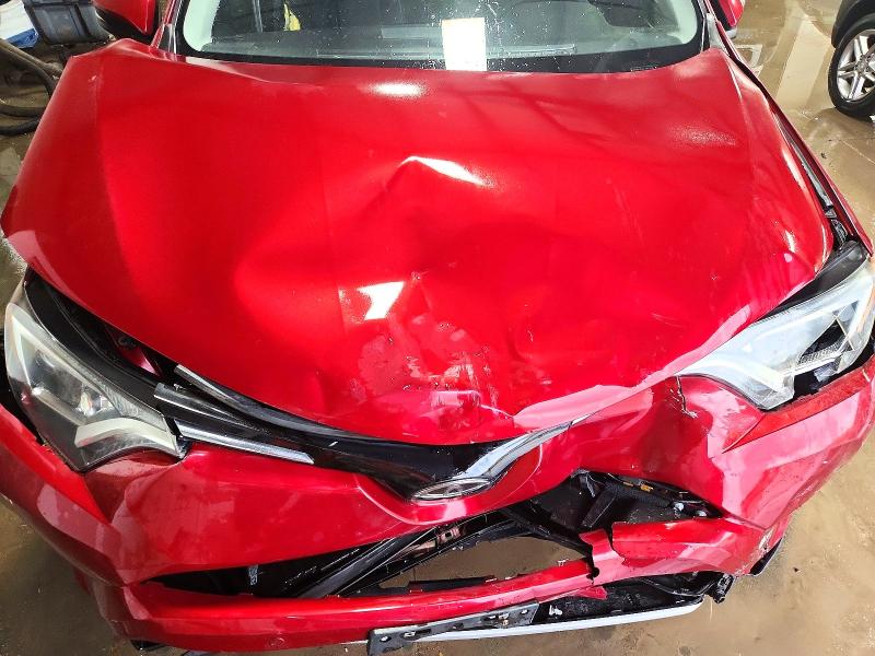 Photo 11 from auction – 2018 TOYOTA RAV4 with VIN 2T3RFREV6JW853594
