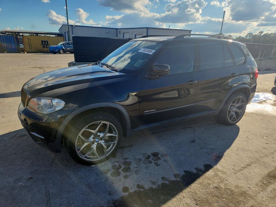 BMW X5 2013 with VIN 5UXZW0C58D0B91395 - Photo from auction