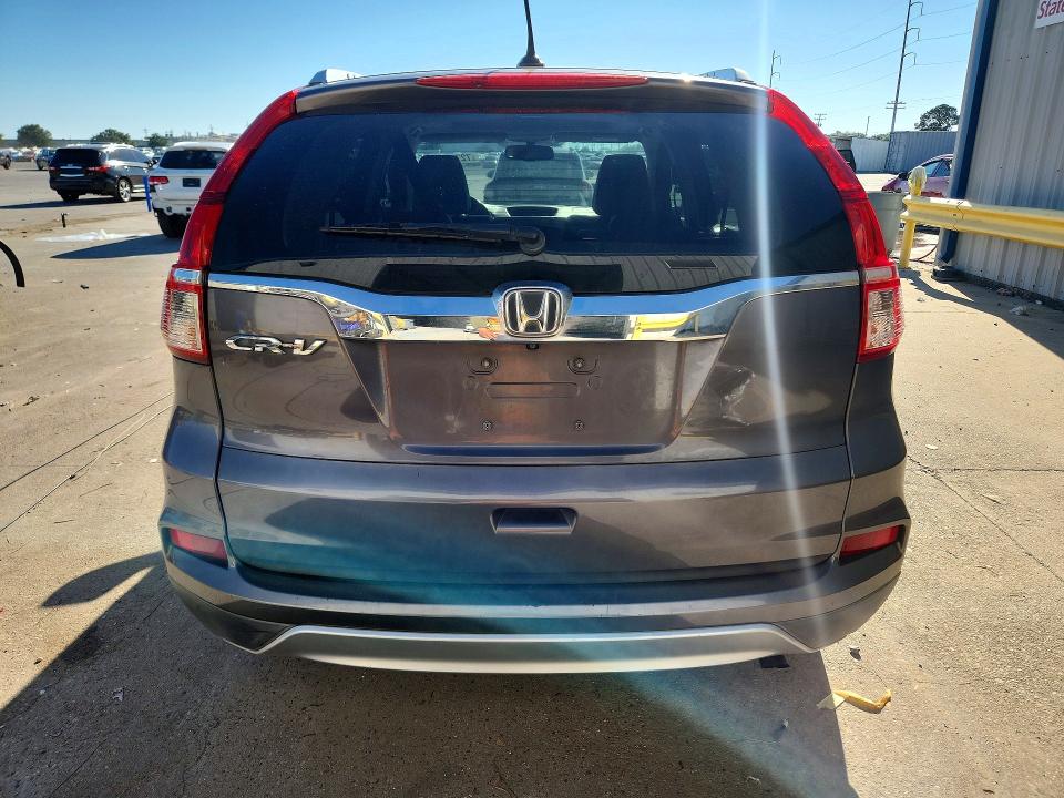 Photo 6 from auction – 2015 HONDA CR-V with VIN 2HKRM3H75FH517594