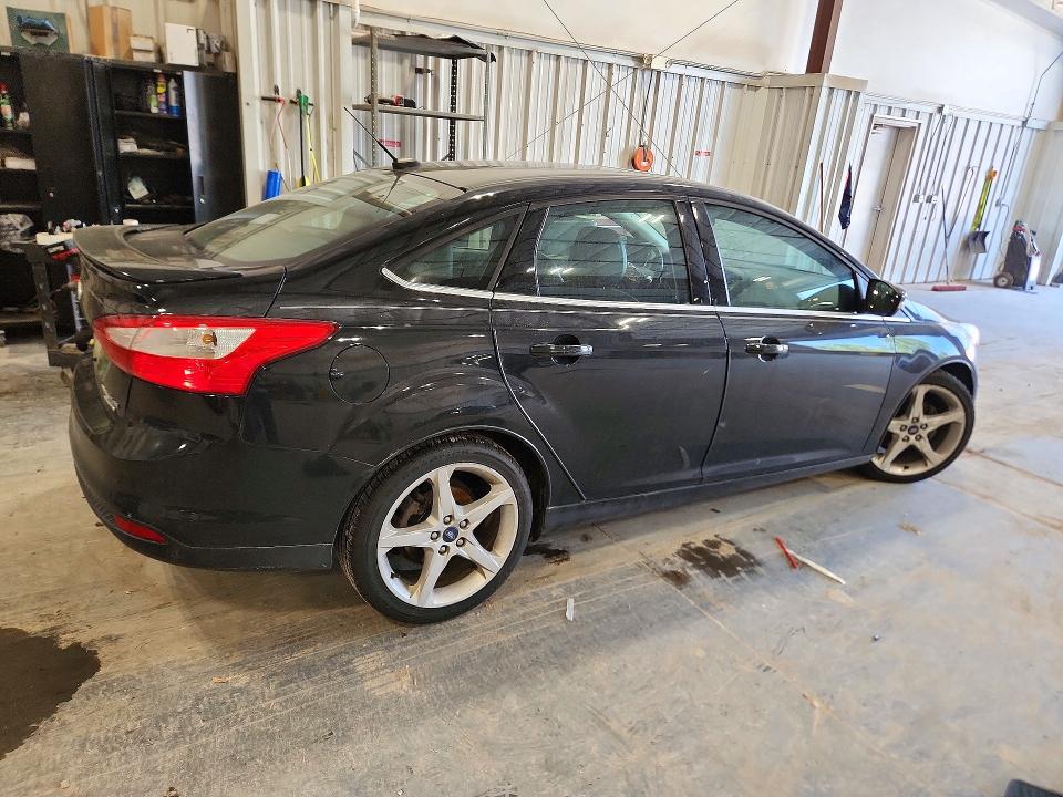 Foto 3 de la subasta – 2014 FORD FOCUS con VIN 1FADP3J22EL105181