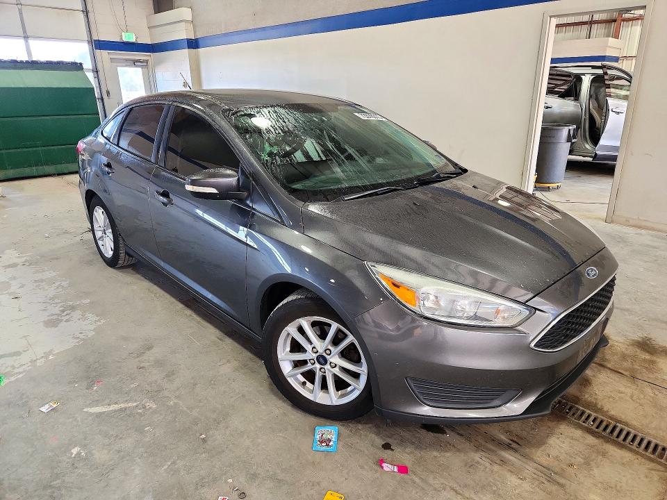 Снимка 4 от търг – 2016 FORD FOCUS с VIN 1FADP3F21GL402809