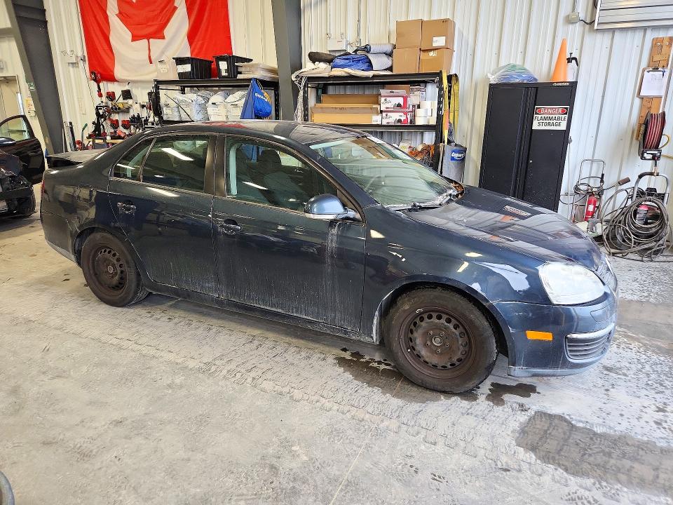 Снимка 4 от търг – 2010 VOLKSWAGEN JETTA с VIN 3VWJX7AJXAM060850