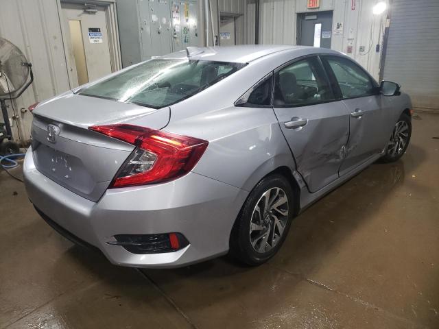 Photo 3 from auction – 2018 HONDA CIVIC EX with VIN 19XFC2F70JE000574