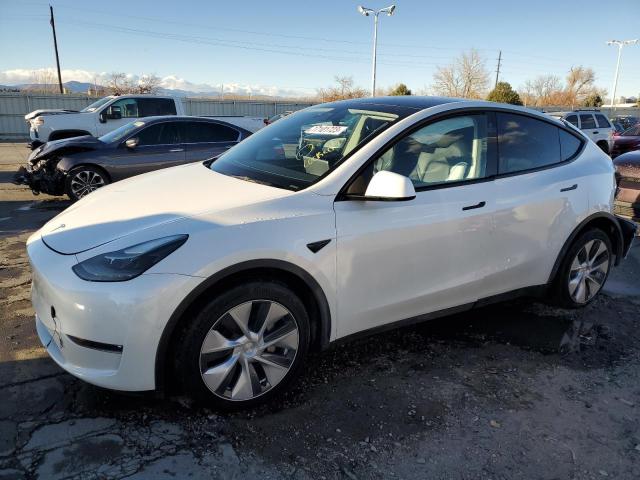 TESLA MODEL Y 2022 with VIN 7SAYGAEE8NF523755 - Photo from auction