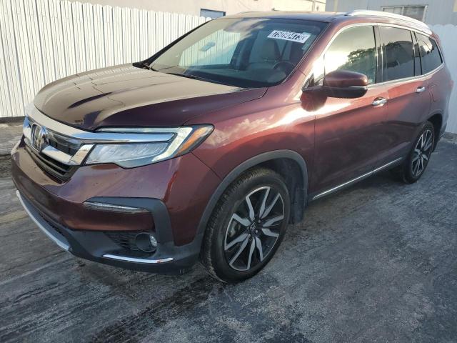 HONDA PILOT TOUR 2021 with VIN 5FNYF5H63MB017857 - Photo from auction
