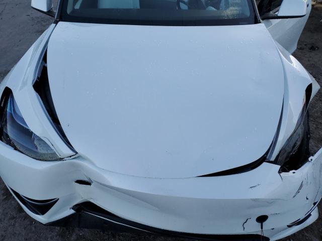 Photo 11 from auction – 2023 TESLA MODEL Y with VIN 7SAYGAEE7PF646028
