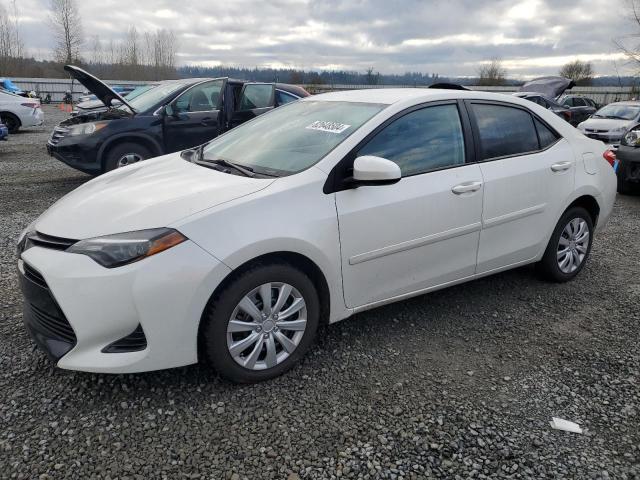 TOYOTA COROLLA L 2019 with VIN 5YFBURHE6KP935145 - Photo from auction