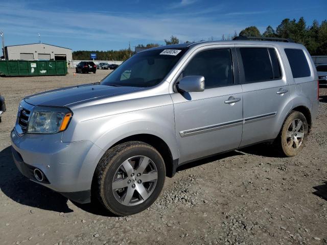 HONDA PILOT TOUR 2014 with VIN 5FNYF3H95EB011588 - Photo from auction