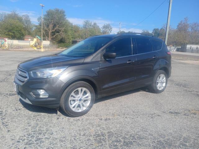 Photo 2 from auction – 2018 FORD ESCAPE SE with VIN 1FMCU0GD2JUD06066