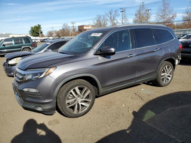 HONDA PILOT ELIT 2018 with VIN 5FNYF6H04JB049598 - Photo from auction