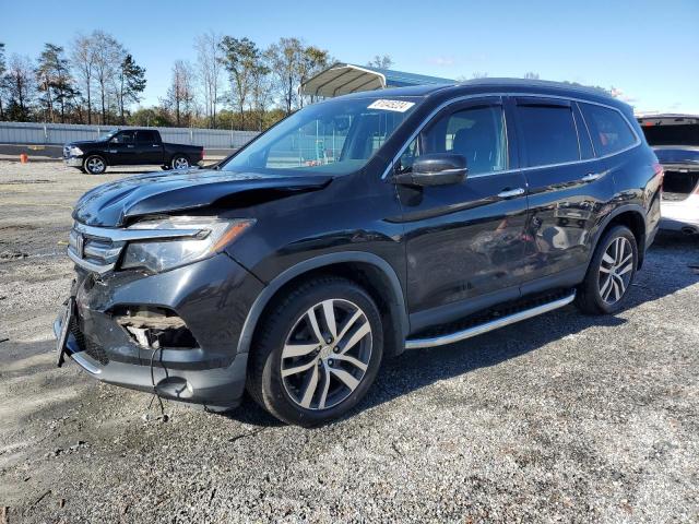 HONDA PILOT ELIT 2017 with VIN 5FNYF6H05HB088792 - Photo from auction