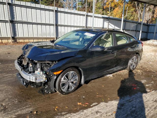 HONDA CIVIC EX 2018 with VIN JHMFC1F34JX024141 - Photo from auction