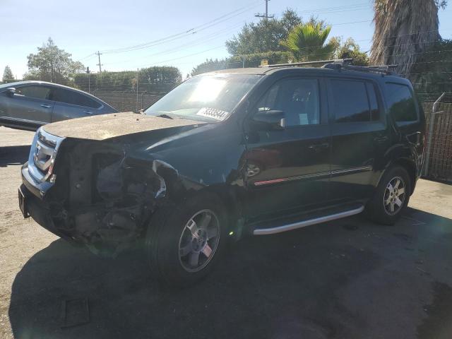 HONDA PILOT TOUR 2011 with VIN 5FNYF4H97BB033819 - Photo from auction