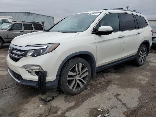 HONDA PILOT TOUR 2017 with VIN 5FNYF6H96HB050311 - Photo from auction