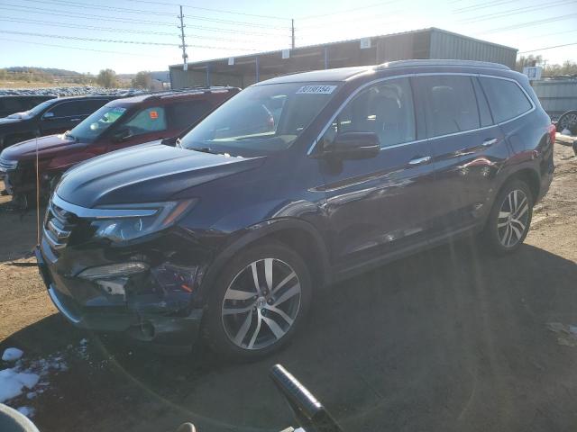 HONDA PILOT ELIT 2018 with VIN 5FNYF6H05JB055619 - Photo from auction