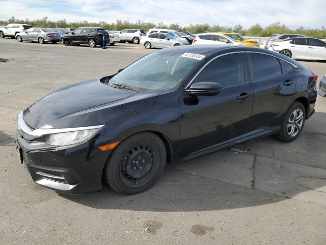 HONDA CIVIC LX 2018 with VIN 2HGFC2F59JH510698 - Photo from auction