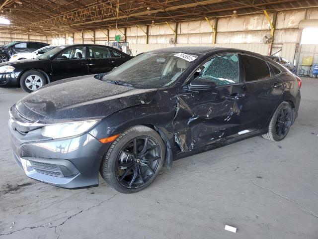 HONDA CIVIC EX 2017 with VIN 2HGFC2F74HH509096 - Photo from auction