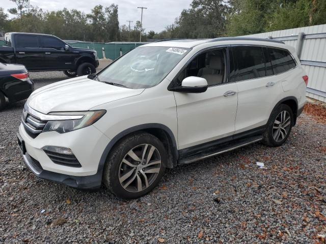 HONDA PILOT TOUR 2016 with VIN 5FNYF5H93GB020238 - Photo from auction