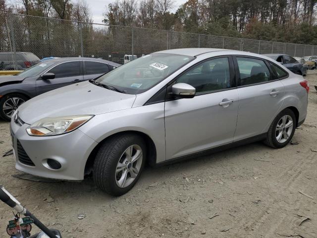 FORD FOCUS SE 2014 with VIN 1FADP3F24EL403613 - Photo from auction