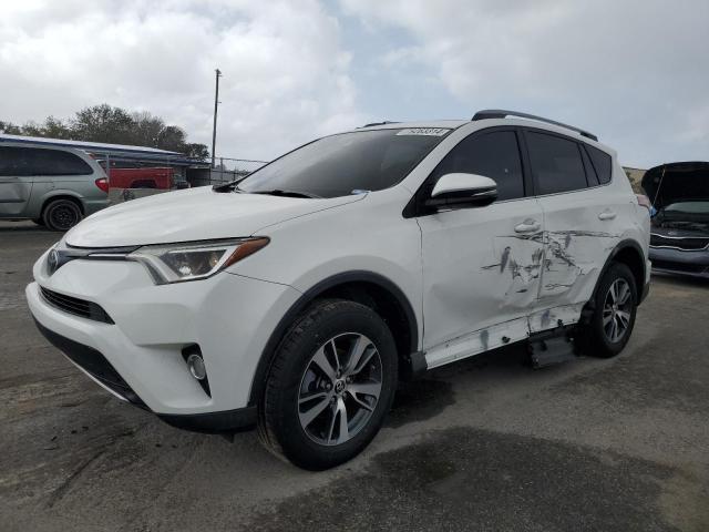 TOYOTA RAV4 XLE 2017 with VIN 2T3WFREV6HW386576 - Photo from auction