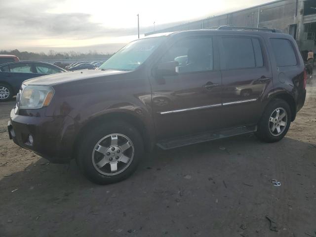 HONDA PILOT TOUR 2011 with VIN 5FNYF4H96BB031284 - Photo from auction