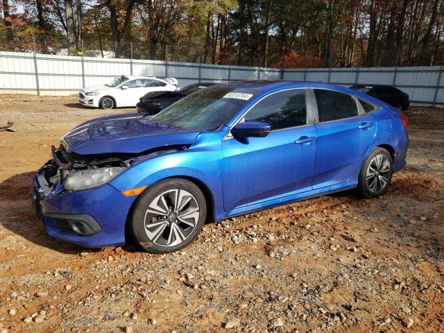 HONDA CIVIC EX 2017 with VIN 2HGFC1F34HH653240 - Photo from auction
