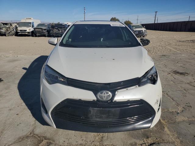Photo 5 from auction – 2017 TOYOTA COROLLA L with VIN 5YFBURHE4HP572711